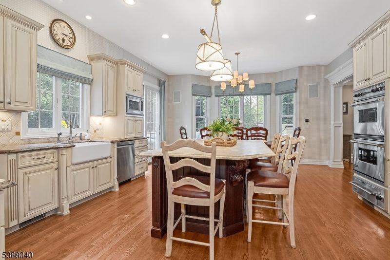 Dining room, Interior, Kitchen, Pendant Lights, Recessed Lighting, Stainless Steel Appliances, Wood Texture Flooring