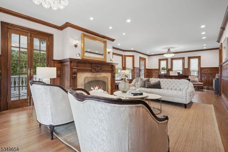Chandelier, Fireplace, Interior, Living room, Recessed Lighting, Wood Texture Flooring