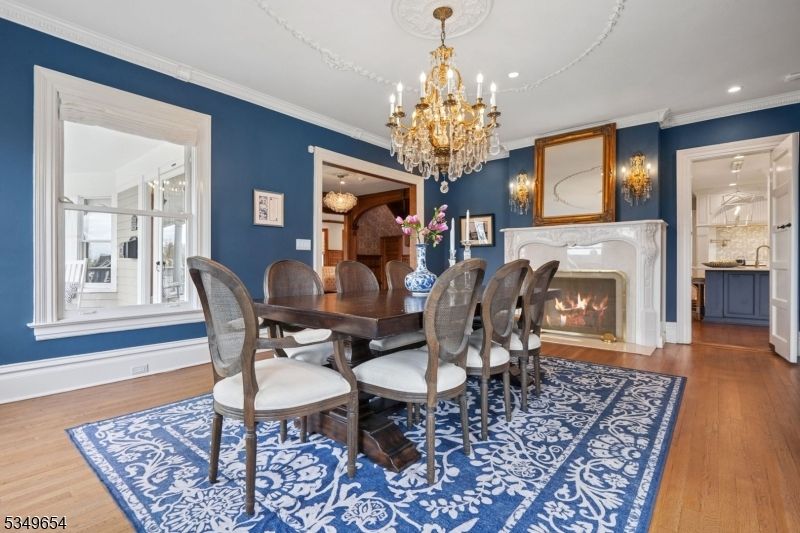 Chandelier, Dining room, Fireplace, Interior, Recessed Lighting, Wood Texture Flooring