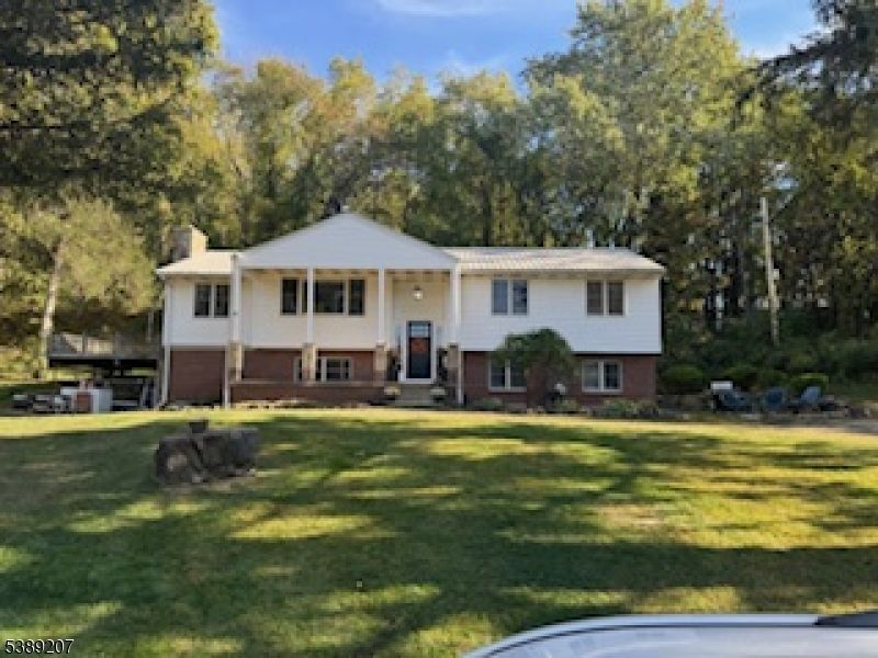 Attached, Backyard, Exterior, Facade, Brick Facade, Raised Ranch