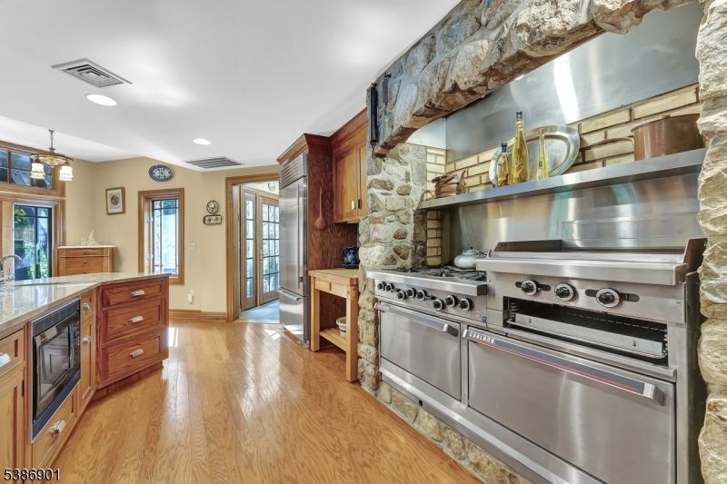 Interior, Kitchen, Pendant Lights, Recessed Lighting, Stainless Steel Appliances, Stone Walls, Wood Texture Flooring