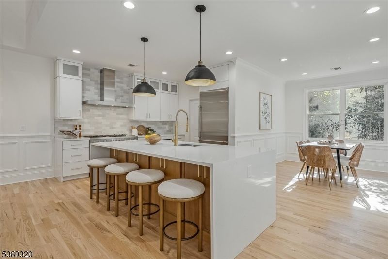Dining room, Interior, Kitchen, Pendant Lights, Recessed Lighting, Stainless Steel Appliances, Wood Texture Flooring