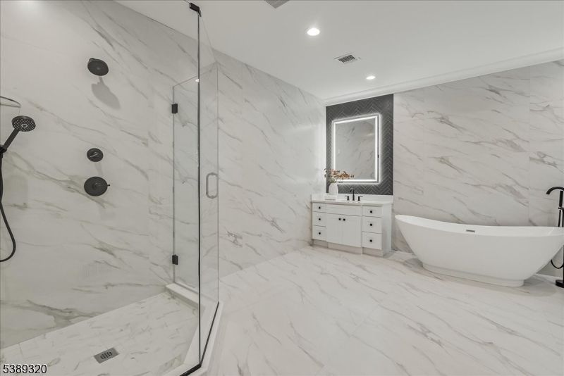 Bathroom, Free Standing Baths, Glass Shower, Interior, Marble, Marble Walls, Recessed Lighting