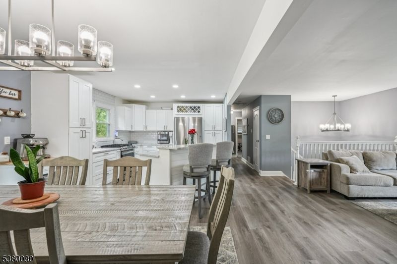 Chandelier, Dining room, Interior, Kitchen, Pendant Lights, Recessed Lighting, Stainless Steel Appliances, Wood Texture Flooring