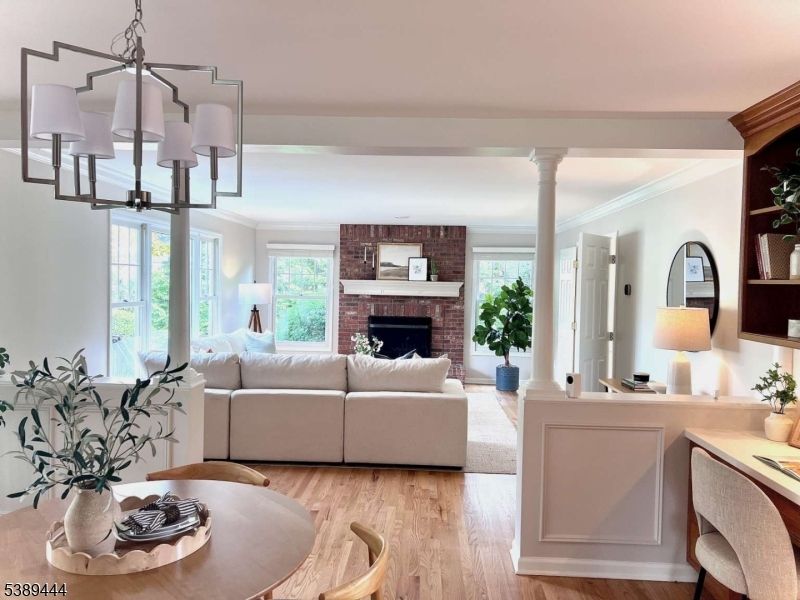 Chandelier, Dining room, Fireplace, Interior, Living room, Stone Walls, Wood Texture Flooring