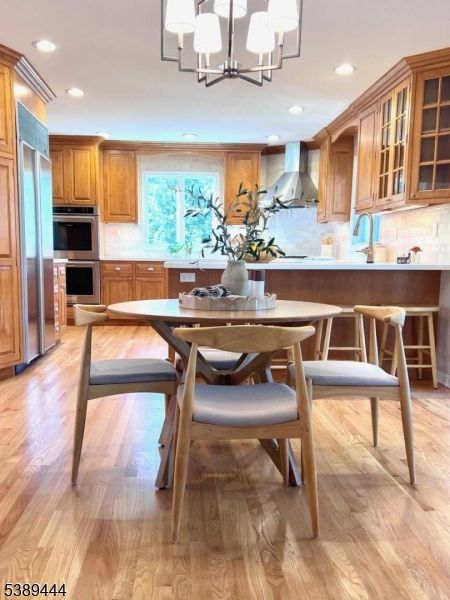 Chandelier, Dining room, Interior, Kitchen, Recessed Lighting, Stainless Steel Appliances, Wood Texture Flooring