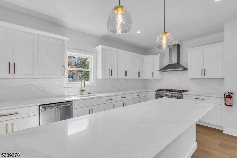 Interior, Kitchen, Marble Walls, Pendant Lights, Recessed Lighting, Stainless Steel Appliances, Wood Texture Flooring
