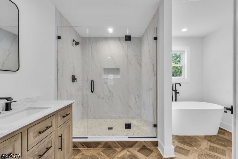 Bathroom, Free Standing Baths, Glass Shower, Interior, Marble, Marble Walls, Recessed Lighting, Wood Texture Flooring