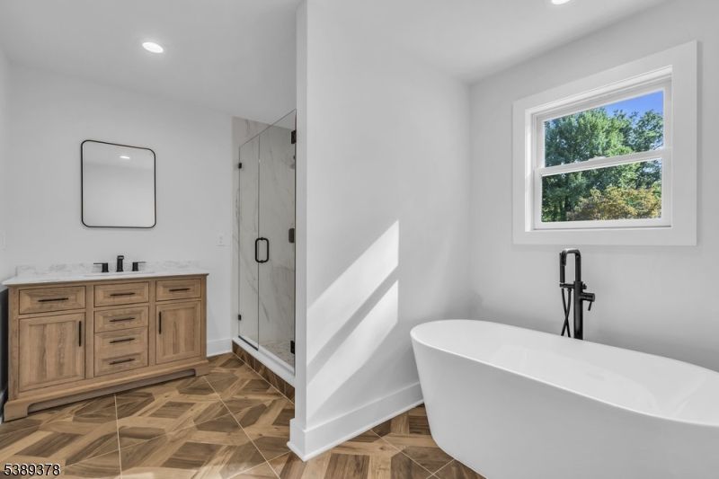 Bathroom, Dual Sink Vanities, Free Standing Baths, Glass Shower, Interior, Marble Walls, Recessed Lighting