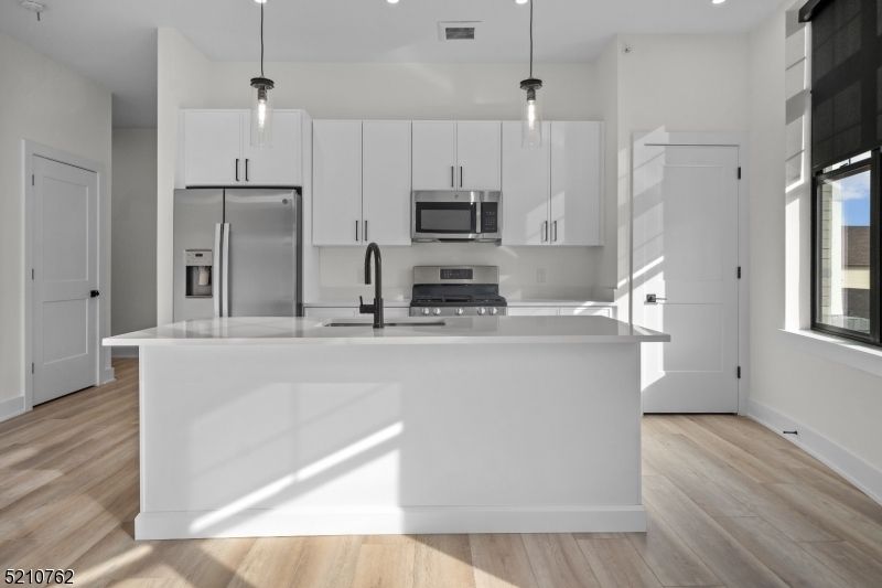 Interior, Kitchen, Pendant Lights, Recessed Lighting, Stainless Steel Appliances, Wood Texture Flooring