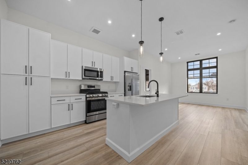 Interior, Kitchen, Pendant Lights, Recessed Lighting, Stainless Steel Appliances, Wood Texture Flooring