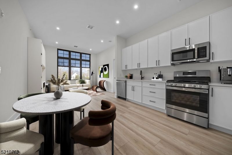 Dining room, Interior, Kitchen, Recessed Lighting, Stainless Steel Appliances, Wood Texture Flooring