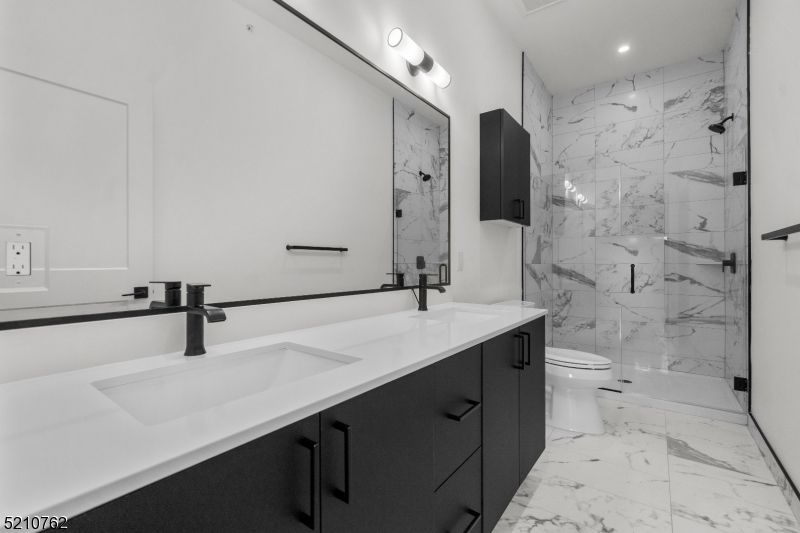 Bathroom, Dual Sink Vanities, Glass Shower, Interior, Marble, Marble Walls, Recessed Lighting