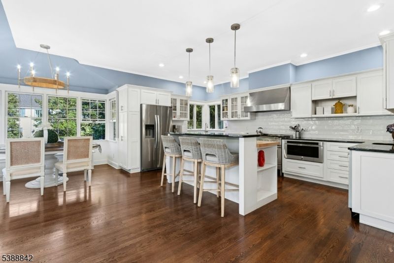 Dining room, Interior, Kitchen, Pendant Lights, Recessed Lighting, Stainless Steel Appliances, Wood Texture Flooring