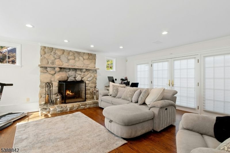 Fireplace, Interior, Living room, Recessed Lighting, Stone Walls, Wood Texture Flooring