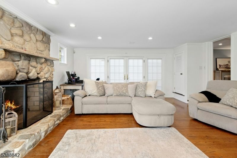 Fireplace, Interior, Living room, Recessed Lighting, Stone Walls, Wood Texture Flooring