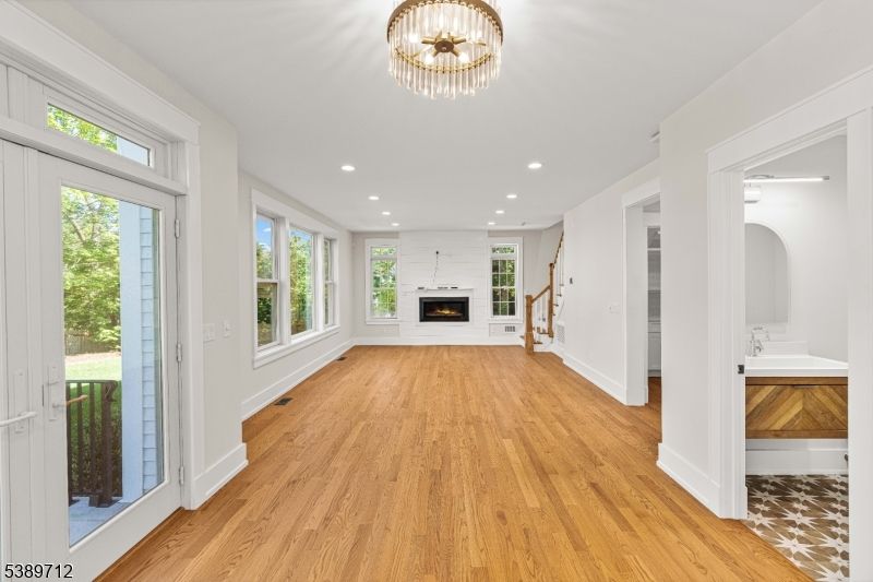 Empty room, Fireplace, Interior, Recessed Lighting, Wood Texture Flooring