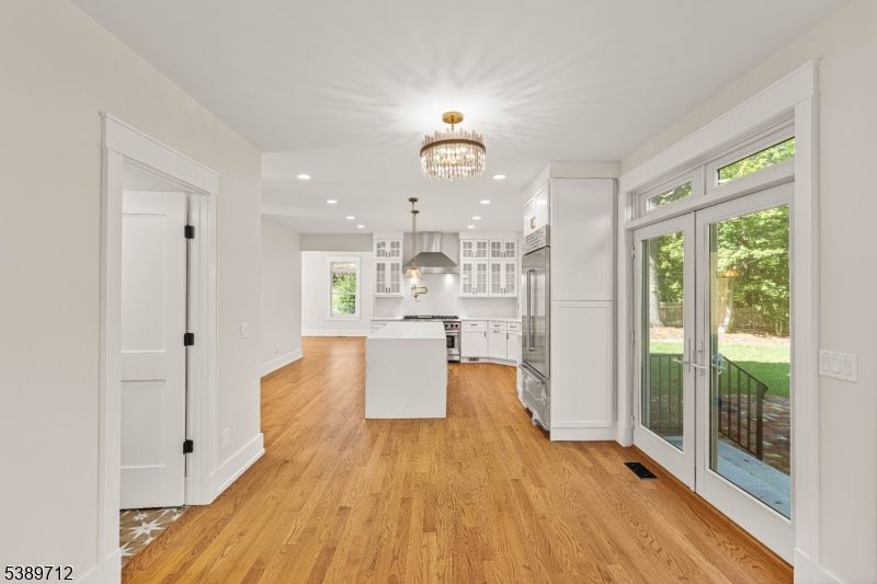 Chandelier, Interior, Kitchen, Pendant Lights, Recessed Lighting, Stainless Steel Appliances, Wood Texture Flooring
