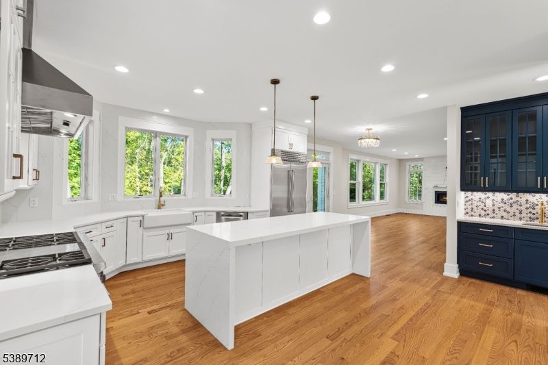 Chandelier, Interior, Kitchen, Pendant Lights, Recessed Lighting, Stainless Steel Appliances, Wood Texture Flooring