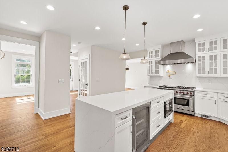 Interior, Kitchen, Marble Walls, Pendant Lights, Recessed Lighting, Stainless Steel Appliances, Wood Texture Flooring