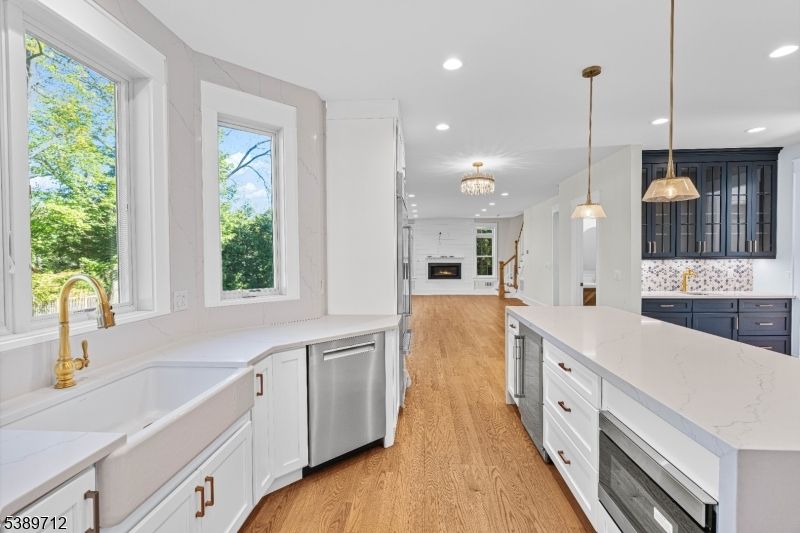 Chandelier, Interior, Kitchen, Pendant Lights, Recessed Lighting, Stainless Steel Appliances, Wood Texture Flooring