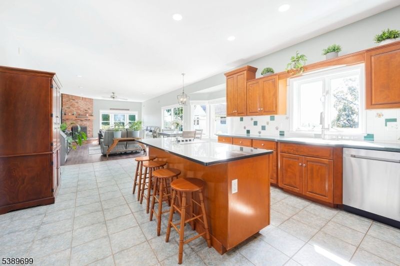 Fireplace, Interior, Kitchen, Living room, Pendant Lights, Recessed Lighting, Stainless Steel Appliances, Stone Walls