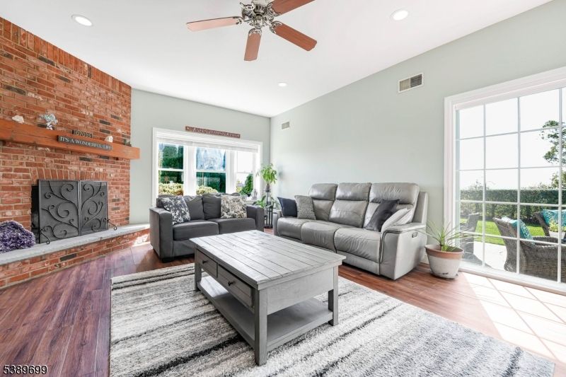 Fireplace, Interior, Living room, Recessed Lighting, Stone Walls, Wood Texture Flooring