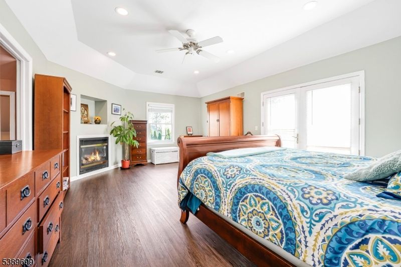 Bedroom, Fireplace, Interior, Recessed Lighting, Wood Texture Flooring