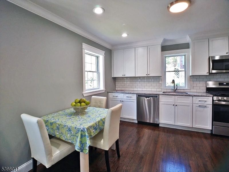 Dining room, Interior, Kitchen, Recessed Lighting, Stainless Steel Appliances, Wood Texture Flooring