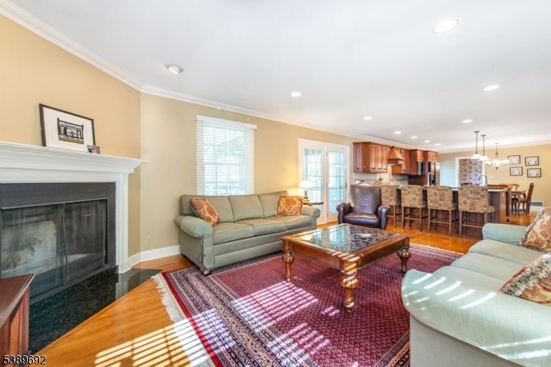 Dining room, Fireplace, Interior, Kitchen, Living room, Pendant Lights, Recessed Lighting, Stainless Steel Appliances, Wood Texture Flooring