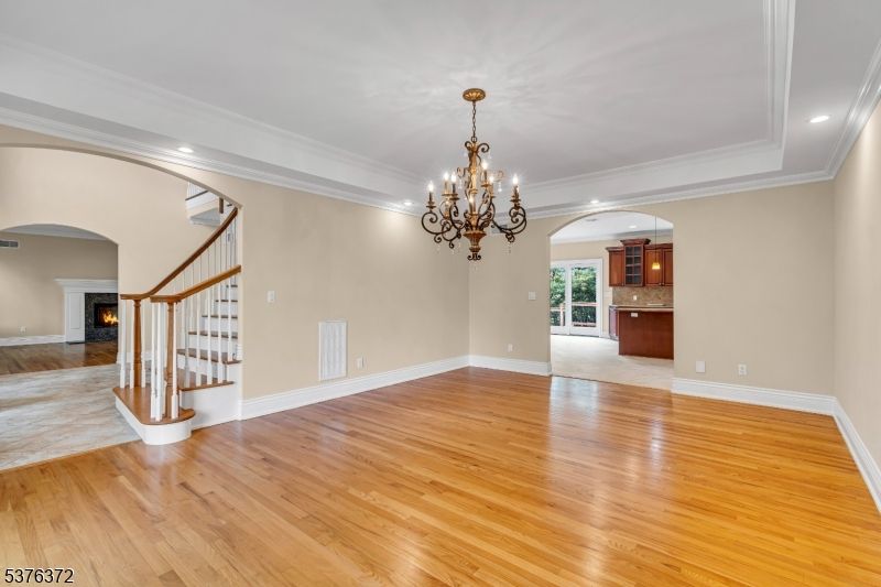 Chandelier, Empty room, Fireplace, Interior, Recessed Lighting, Wood Texture Flooring