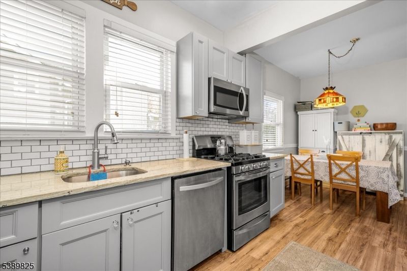 Dining room, Interior, Kitchen, Pendant Lights, Stainless Steel Appliances, Wood Texture Flooring