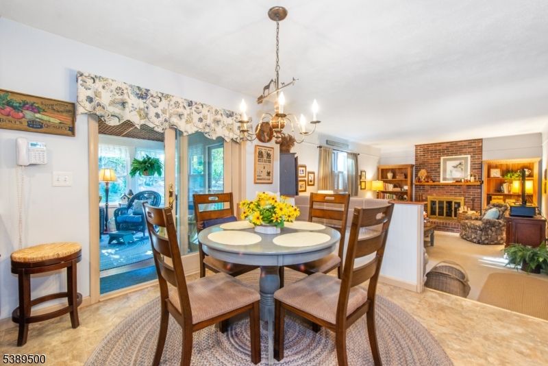 Chandelier, Dining room, Fireplace, Interior, Living room, Stone Walls