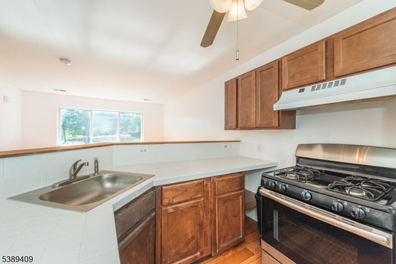 Interior, Kitchen, Tile Countertops, Wood Texture Flooring