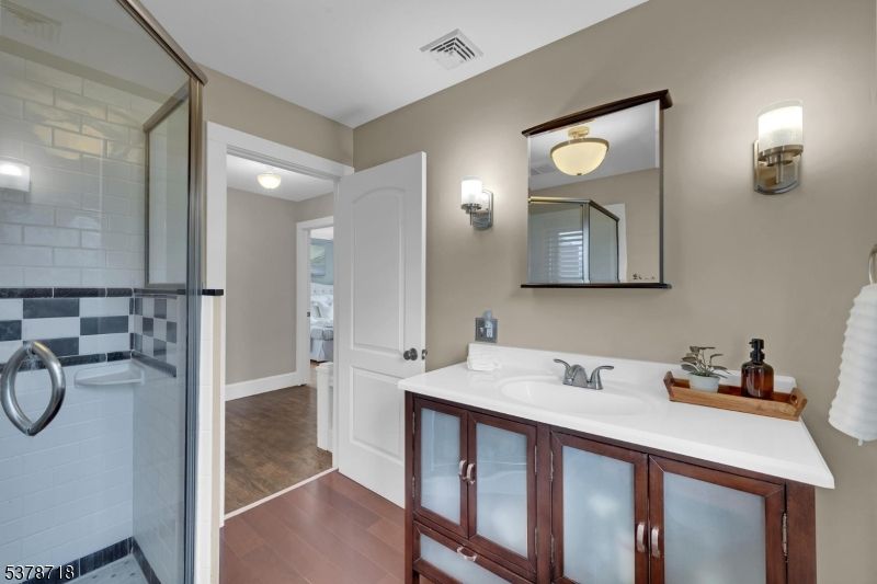 Bathroom, Dual Sink Vanities, Glass Shower, Interior, Wood Texture Flooring