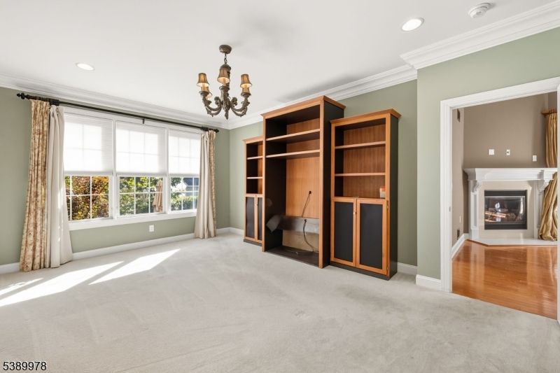 Chandelier, Empty room, Fireplace, Interior, Recessed Lighting, Wood Texture Flooring