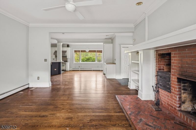 Empty room, Fireplace, Interior, Recessed Lighting, Stone Walls, Wood Texture Flooring