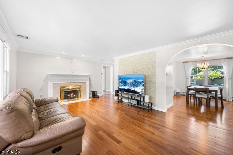 Chandelier, Dining room, Fireplace, Interior, Living room, Recessed Lighting, Wood Texture Flooring