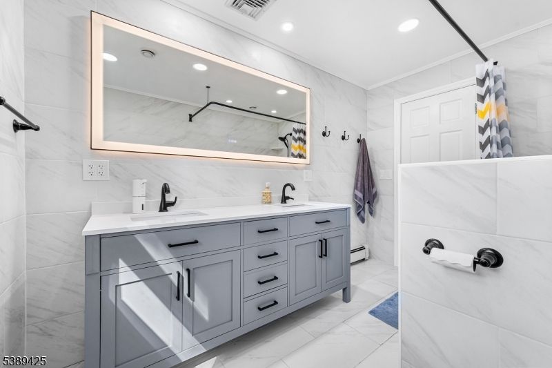 Bathroom, Dual Sink Vanities, Interior, Marble, Marble Walls, Recessed Lighting