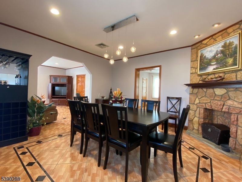 Dining room, Fireplace, Interior, Pendant Lights, Recessed Lighting, Wood Texture Flooring