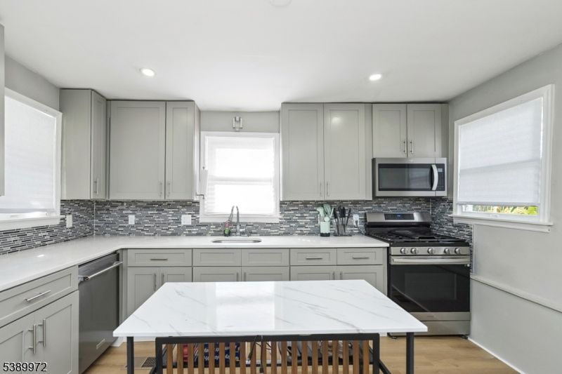Interior, Kitchen, Recessed Lighting, Stainless Steel Appliances, Wood Texture Flooring