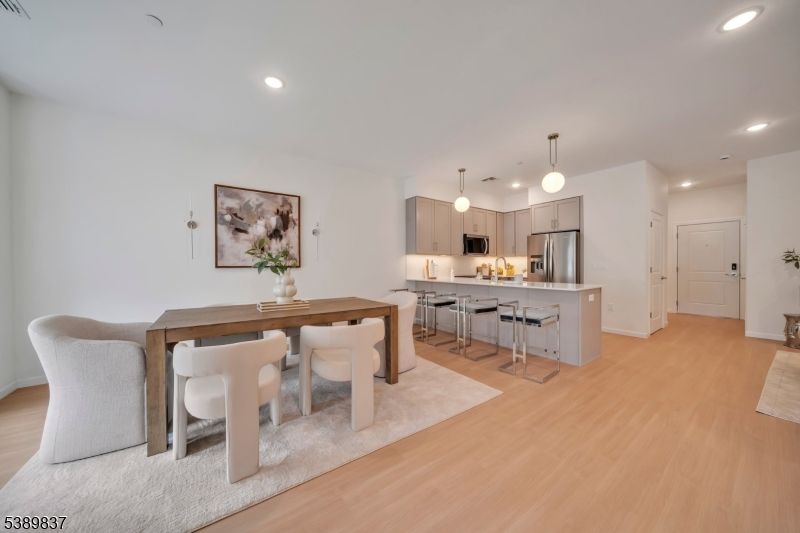 Dining room, Interior, Kitchen, Pendant Lights, Recessed Lighting, Stainless Steel Appliances, Wood Texture Flooring