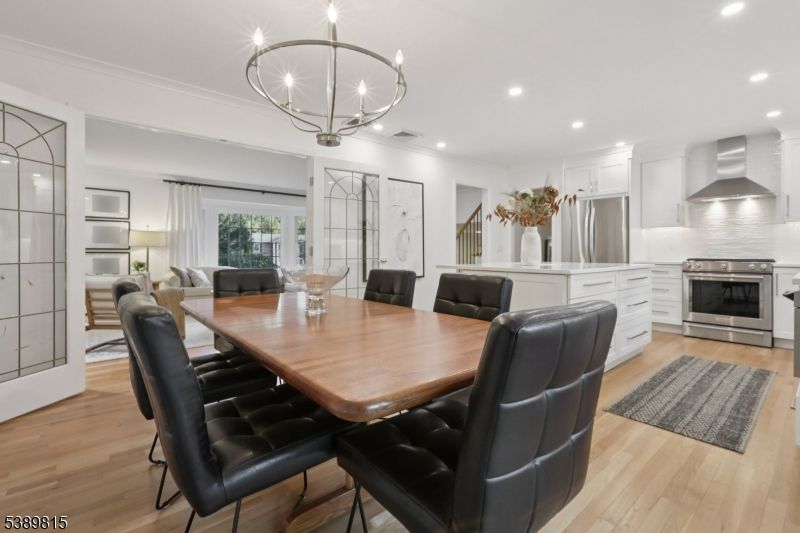 Chandelier, Dining room, Interior, Kitchen, Recessed Lighting, Stainless Steel Appliances, Wood Texture Flooring