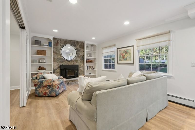 Fireplace, Interior, Living room, Recessed Lighting, Stone Walls, Wood Texture Flooring