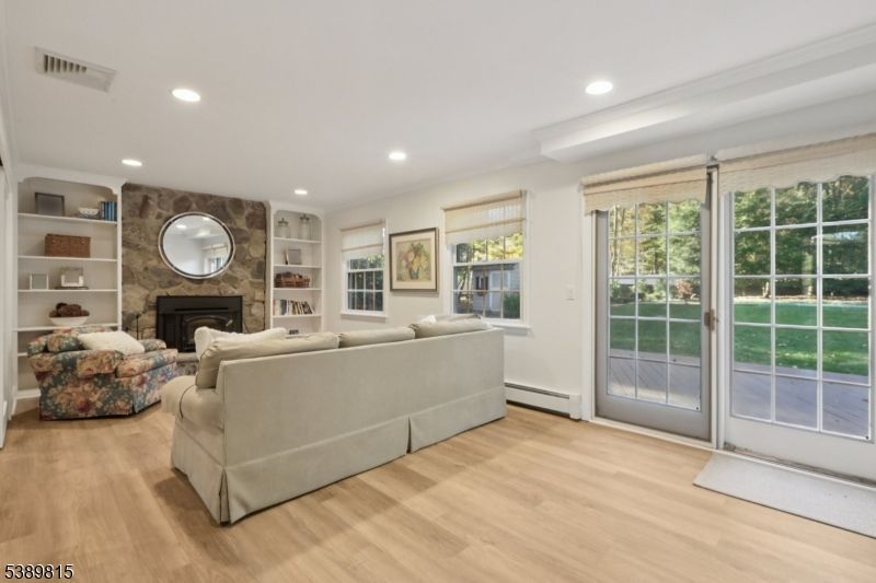 Fireplace, Interior, Living room, Recessed Lighting, Stone Walls, Wood Texture Flooring