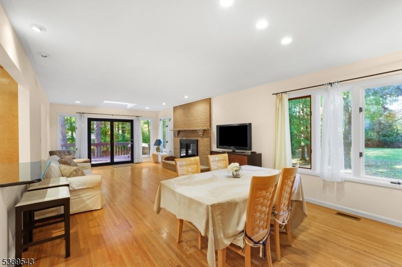 Dining room, Fireplace, Interior, Living room, Recessed Lighting, Wood Texture Flooring
