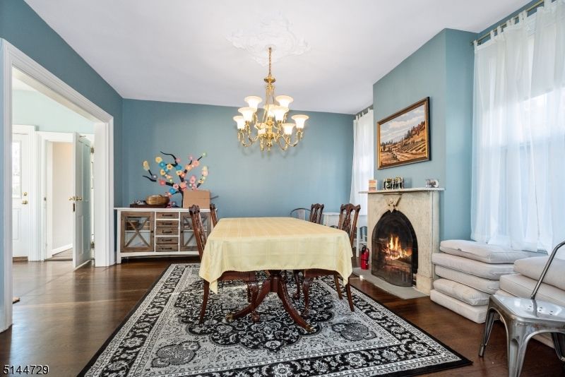 Chandelier, Dining room, Fireplace, Interior, Wood Texture Flooring