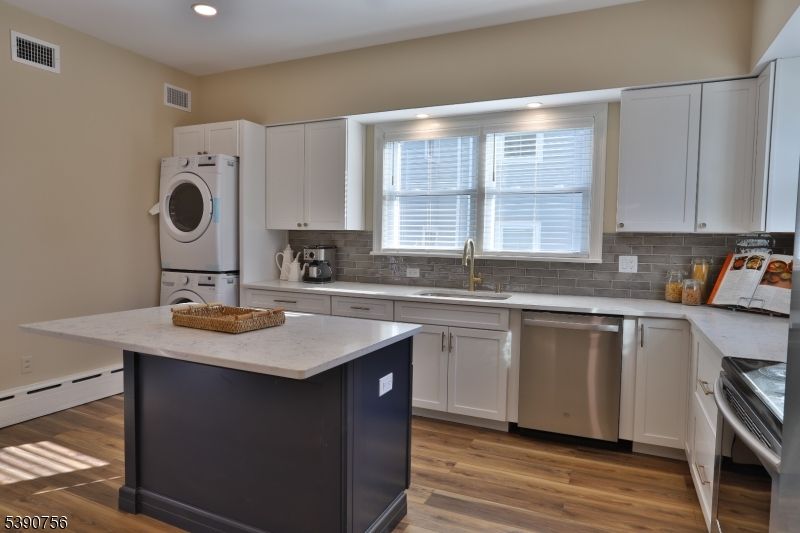 Interior, Kitchen, Recessed Lighting, Stainless Steel Appliances, Washer, Wood Texture Flooring