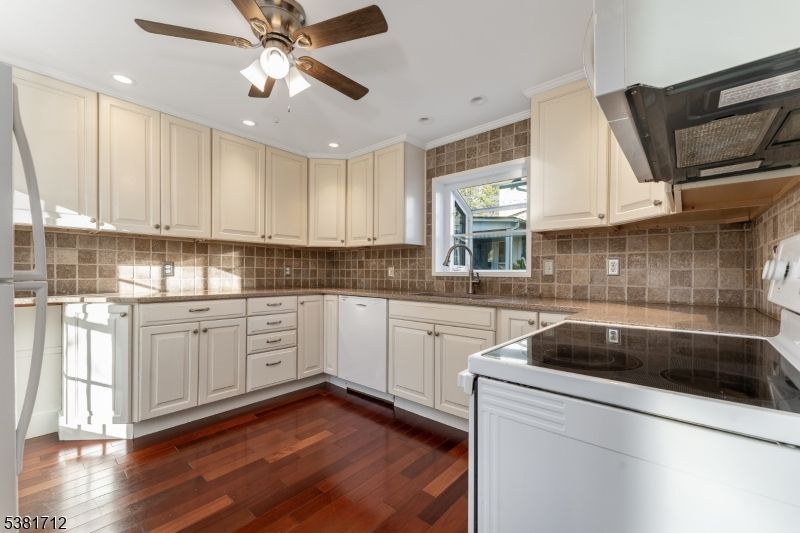 Interior, Kitchen, Recessed Lighting, Tile Countertops, Wood Texture Flooring