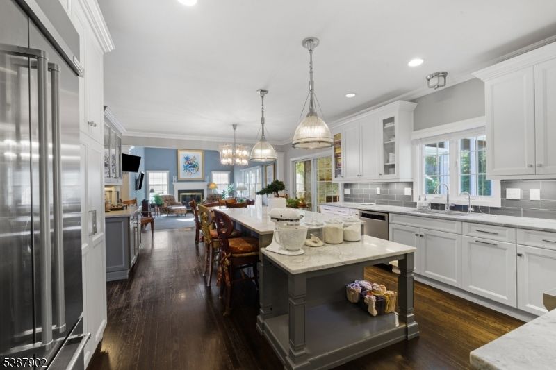 Chandelier, Dining room, Interior, Kitchen, Pendant Lights, Recessed Lighting, Stainless Steel Appliances, Wood Texture Flooring